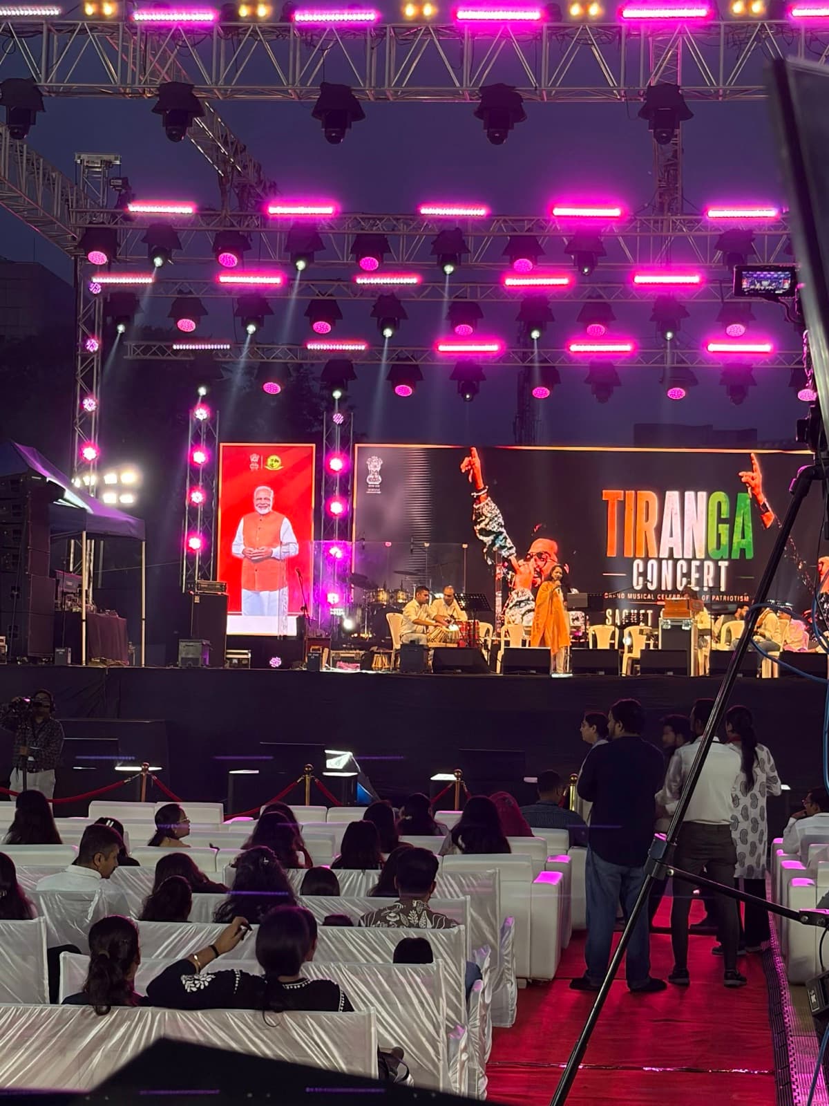 Tiranga Concert stage and seated audience at Bhagwat Katha Ground in Gandhinagar before the surprise drone show